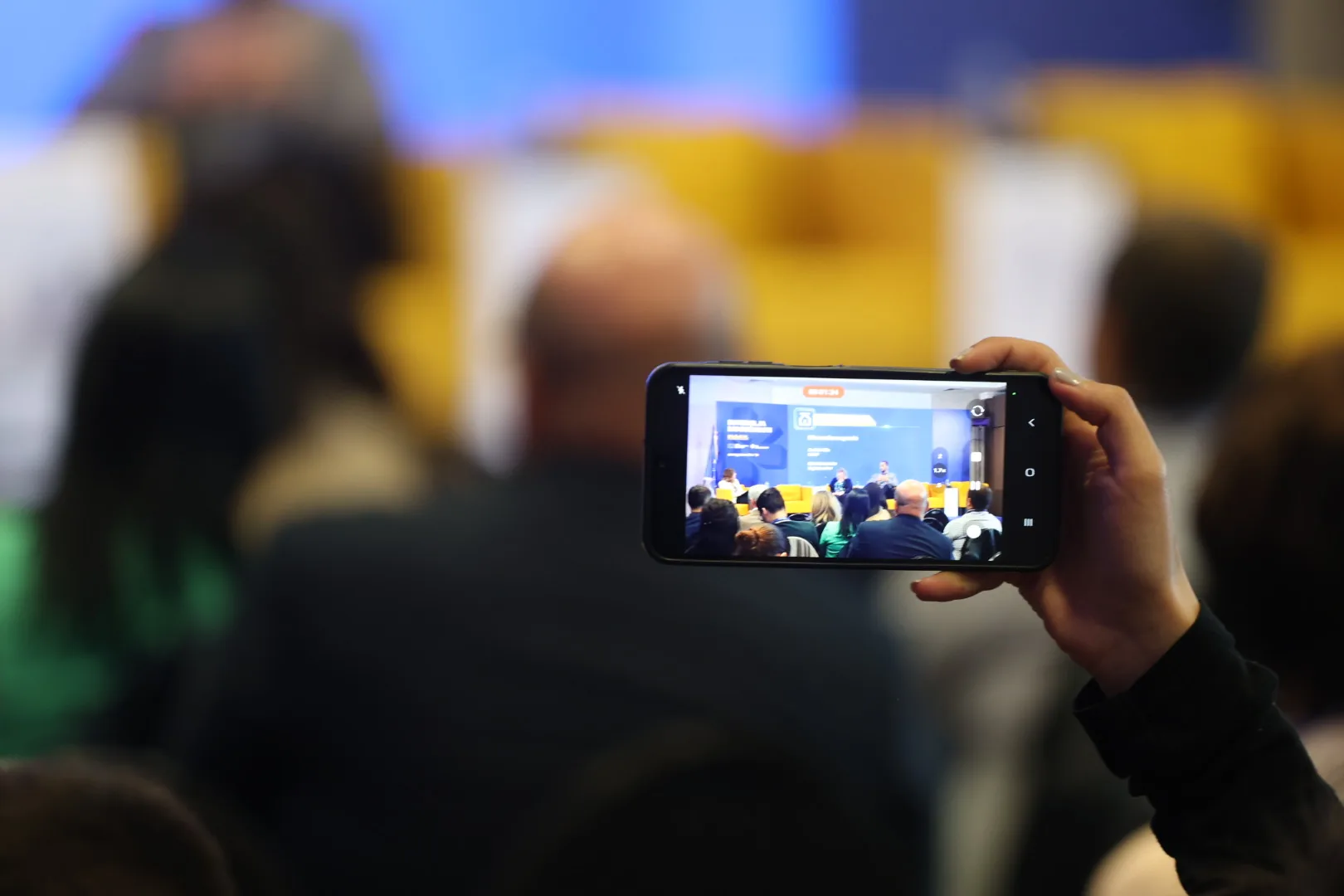 Audience recording the panel at EU Opportunities Week 2026